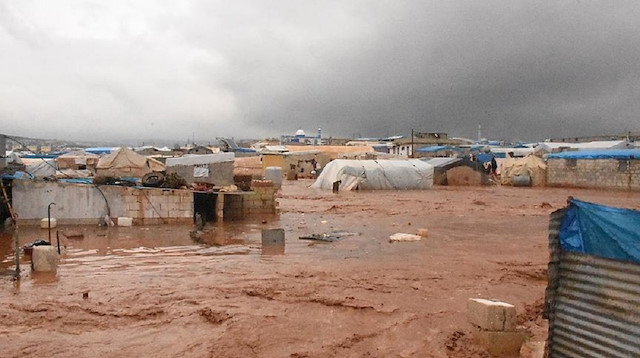 Rain, floods wipe out 11 refugee camps in N. Syria.