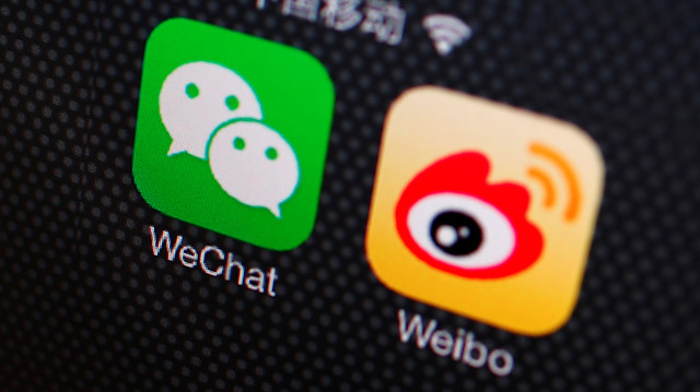 Icons of WeChat and Weibo apps are seen on a smartphone in this picture illustration.