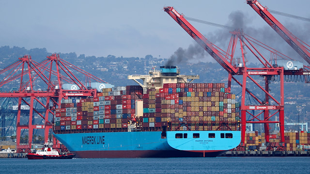 A Maersk Line container ship prepares to depart port in Long Beach