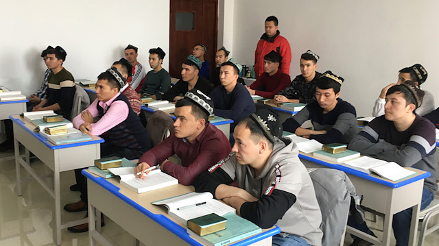 Islamic studies students attend a class at the Xinjiang Islamic Institute during a government organised trip in Urumqi, Xinjiang Uighur Autonomous Region, China