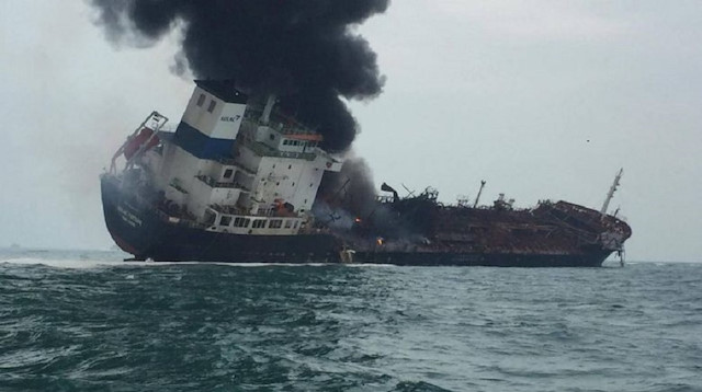 An oil tanker caught fire in Hong Kong's southern waters on Tuesday, killing one crew member while at least 21 were rescued.