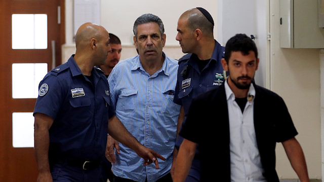 File Photo: Gonen Segev, a former Israeli cabinet minister indicted on suspicion of spying for Iran, is escorted by prison guards as he arrives to court in Jerusalem