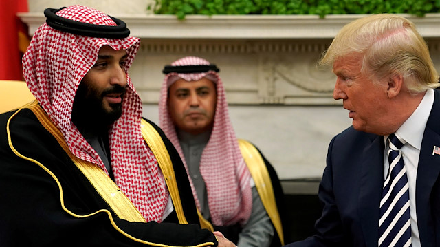 U.S. President Donald Trump shakes hands with Saudi Arabia's Crown Prince Mphammed bin Salman