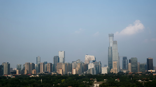 The skyscrapers of the Central Business District rise behind the capital's embassy neighbourhood in Beijing, China.