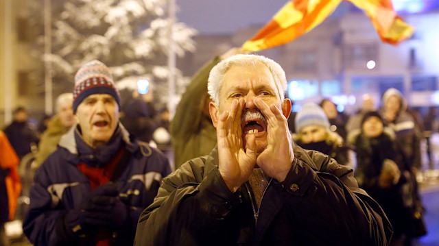 Supporters of the movement boycotting the deal with neighboring Greece to change the country's name to the Republic of North Macedonia protest in front of the parliament building during parliamentary debates on constitutional amendments related to the name change, in Skopje, Macedonia.