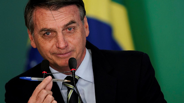 Brezilya Devlet Başkanı Jair Bolsonaro, Brasilia'daki Planalto Sarayı'nda Brezilya'daki silah kısıtlamalarını kolaylaştıran kararnameyi imzaladı.