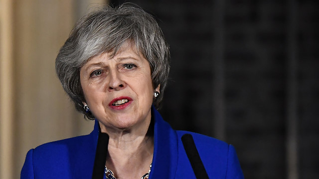 Britain's Prime Minister Theresa May makes a statement following winning a confidence vote, after Parliament rejected her Brexit deal, outside 10 Downing Street in London, Britain