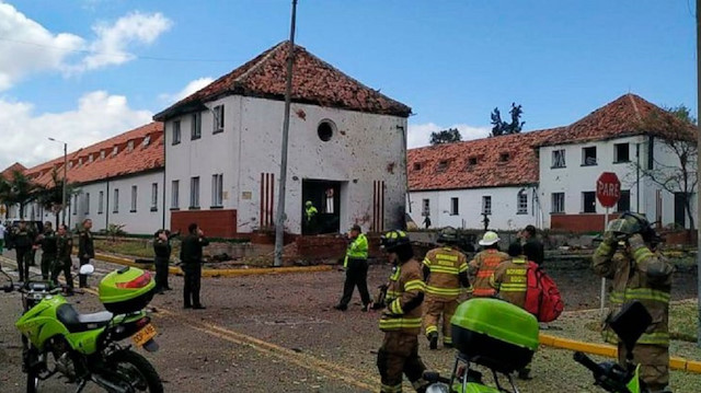 Colombian police raised the death toll from a car bomb that exploded in a police academy in the capital Bogota to 21 on Friday.