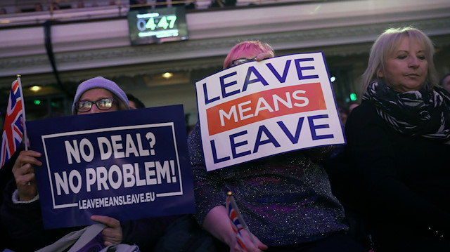 File photo: Brexit supporters hold signs during a "Leave Means Leave" rally in London