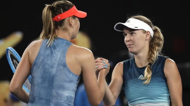Defending Australian Open champion Caroline Wozniacki was defeated by 2008 winner Maria Sharapova on Friday.