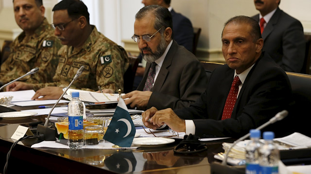 Ahmad Chaudhry, head of Pakistani delegations, (R) listens during a meeting in Kabul