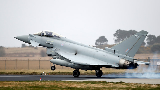 An RAF Typhoon jet lands at RAF Lossiemouth in Scotland, April 13, 2018. REUTERS/Russell Cheyne

