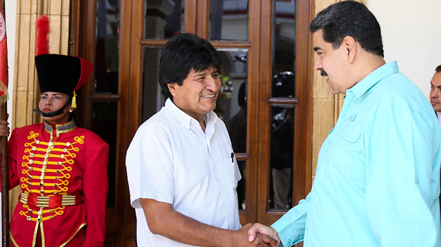File photo: Venezuela's President Nicolas Maduro shakes hands with Bolivia's President Evo Morales as they meet in Caracas, Venezuela