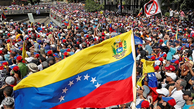 Opposition supporters take part in a rally against Venezuelan President Nicolas Maduro's government and to commemorate the 61st anniversary of the end of the dictatorship of Marcos Perez Jimenez in Caracas, Venezuela.
