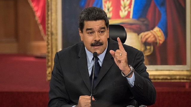 Venezuela's President Nicolas Maduro gestures as he speaks during a news conference 