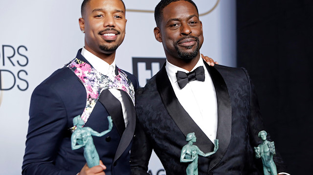 25th Screen Actors Guild Awards – Photo Room – Los Angeles, California, U.S., January 27, 2019 - Sterling K. Brown holds his Outstanding Performance by an Ensemble in a Drama Series award for "This Is Us" and the Outstanding Performance by a Cast in a Motion Picture for "Black Panther" trophies alongside Black Panther cast member Michael B. Jordan. REUTERS/Monica Almeida

