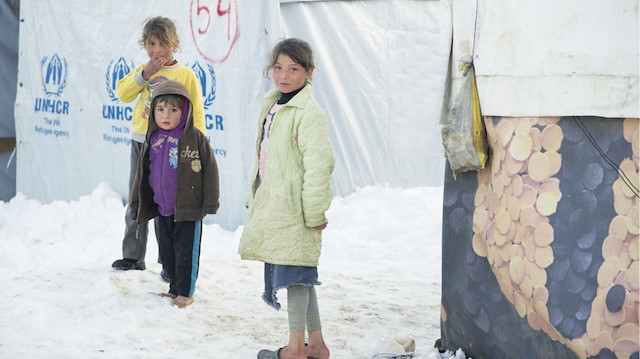 Suriyeli mülteci çocuklar kış aylarında zor günler geçiriyor. (Fotoğraf:  Greg Demarque) 