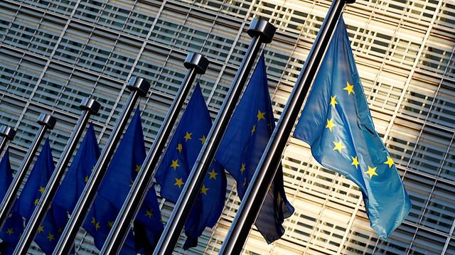 : European Union flags are seen outside the EU Commission headquarters
