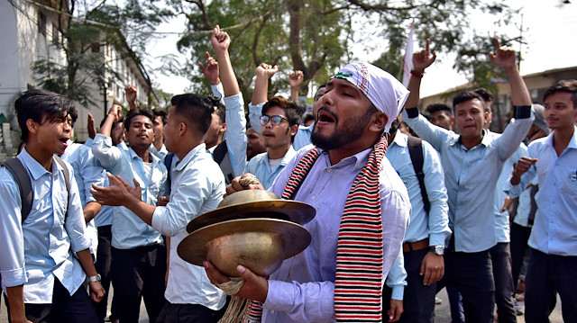 Students shout slogans during a protest to demand the withdrawal of the Citizenship Amendment Bill, a bill passed by India's lower house of parliament that aims to give citizenship to non-Muslims from neighbouring countries, in Nagaon district in the northeastern state of Assam, India.