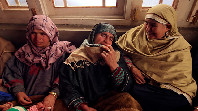 Relatives of Adil Ahmad Dar, who according to police carried out the suicide attack on the Central Reserve Police Force (CRPF) convoy and killed 44 of them on Thursday, mourn inside Adil's residence in Gundbagh village in south Kashmir's Pulwama district.