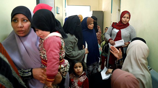 A family planning adviser speaks with Egyptian mothers at a new clinic in the province of Fayoum, southwest of Cairo, Egypt.