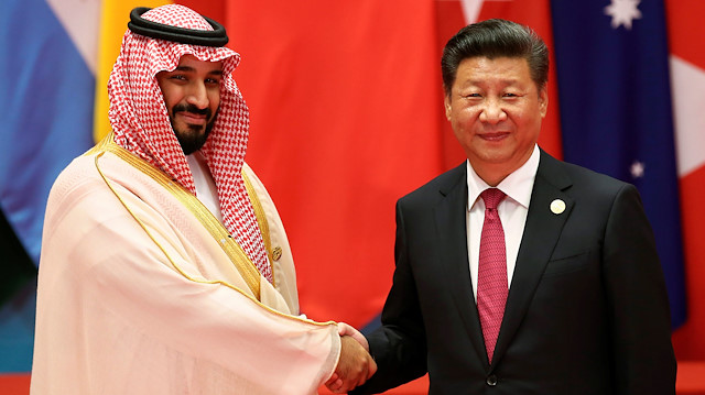 Chinese President Xi Jinping shakes hands with Saudi Arabia's Deputy Crown Prince 