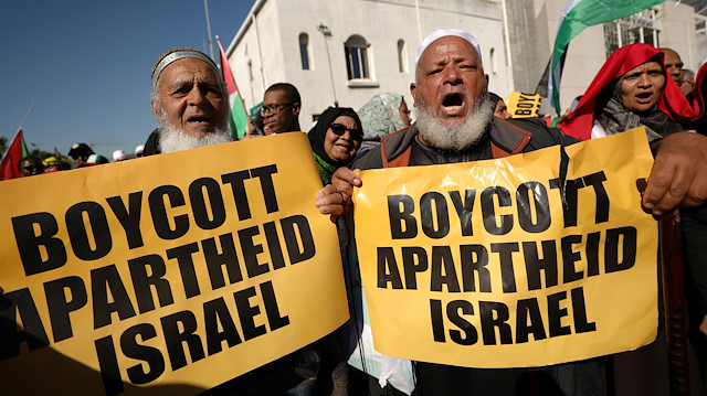 Protestors call for the severing of diplomatic ties with Israel during a march in Cape Town