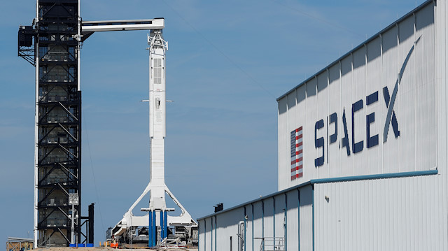A SpaceX Falcon 9 carrying the Crew Dragon spacecraft sits on launch pad 39A 
