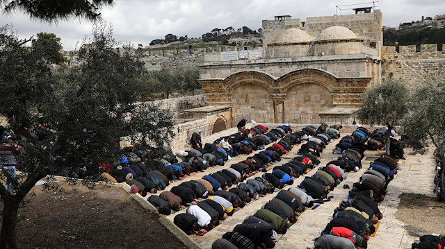 File photo: Palestinian Muslims attend Friday prayers near Al-Aqsa