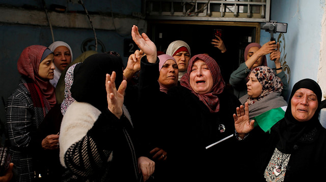 Relatives of Palestinian Samah Mubarak, mourn during her funeral in Ramallah