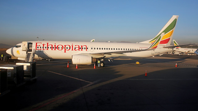 Workers service an Ethiopian Airlines Boeing 737