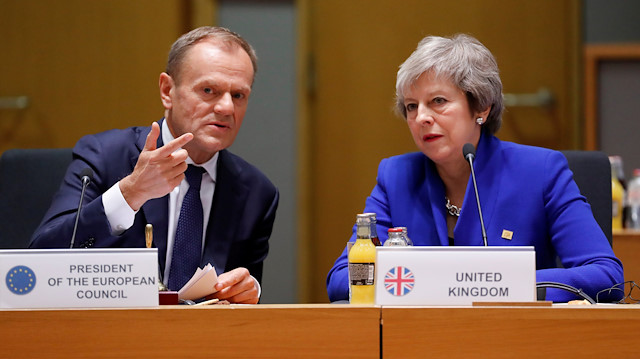 File photo: FILE PHOTO: British Prime Minister Theresa May (R) and European Union Council President Donald Tusk during the extraordinary EU leaders summit to finalise and formalise the Brexit agreement in Brussels