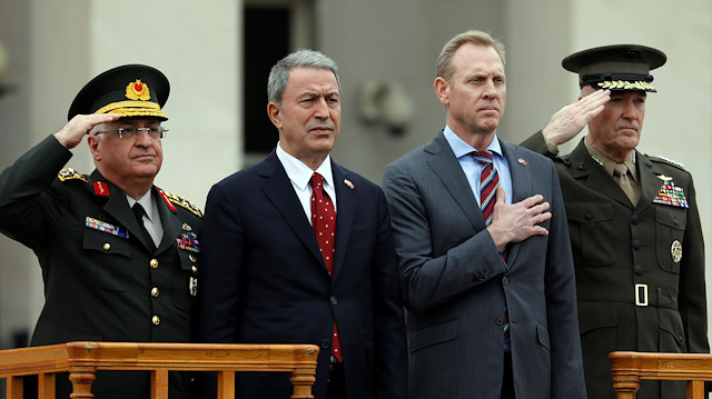 File photo: U.S. Acting Defense Secretary Patrick Shanahan (2nd R) and Joint Chiefs Chairman Marine Gen. Joseph Dunford (R) review troops as they welcome Turkish Minister of Defense Hulusi Akar (2nd L) to the Pentagon in Arlington, Virginia, U.S., February 22, 2019. 