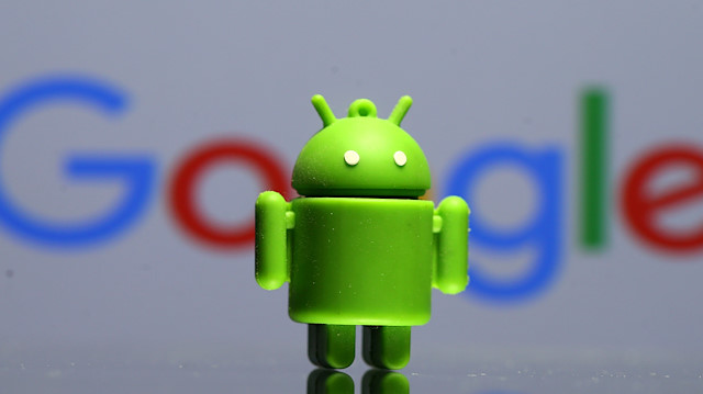 File photo: A 3D printed Android mascot Bugdroid is seen in front of a Google logo 