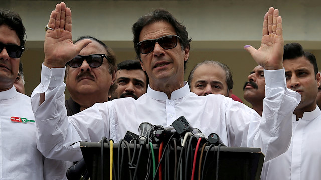 Cricket star-turned-politician Imran Khan, chairman of Pakistan Tehreek-e-Insaf (PTI), speaks after voting in the general election in Islamabad, July 25, 2018. REUTERS/Athit Perawongmetha/File Photo

