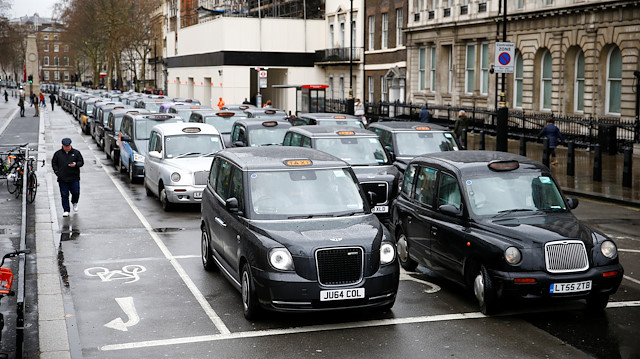 File photo: London taxi drivers stage a road block protest 