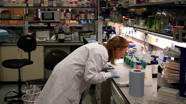 Scientist works in cancer research laboratories at the Old Road Campus research building 