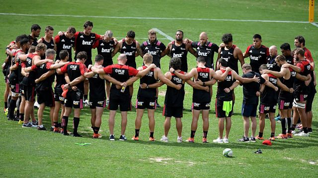 Canterbury Crusaders players and staff pause during their Captain's Run training session for two minute's silence, a week on from the Christchurch attack, at 11.32am Sydney time, at The Scots College, in Sydney, Australia, March 22, 2019. 