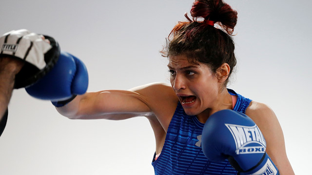 Iranian boxer Sadaf Khadem poses before a training session in preparation to her first official boxing bout in Royan, France, April 11, 2019. Two years after a clandestine impromptu training session on the Tehran hills, Sadaf Khadem will become the first Iranian woman to contest an official boxing fight in western France on Saturday, hoping to lead the way in the Islamic Republic. Picture taken April 11, 2019. REUTERS/Regis Duvignau

