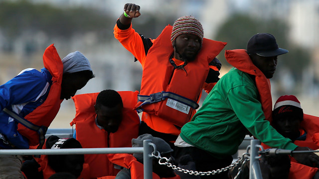Migrants who were stranded on the German NGO Sea-Eye migrant rescue ship Alan Kurdi 