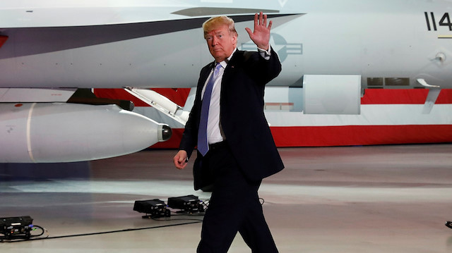 U.S. President Donald Trump waves as he departs Boeing in St. Louis, Missouri,