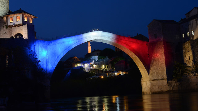 Mostar Bridge is illuminated with the colors of French flag  in Mostar, Bosnia and Herzegovina 