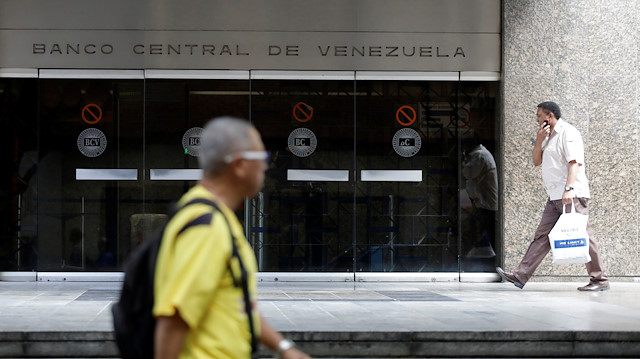 File photo: People walk past an entrance of the Venezuela's Central Bank in Caracas, Venezuela June 22, 2017. 
