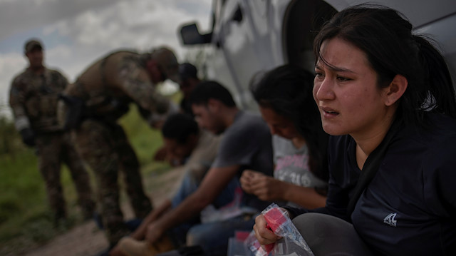 File photo: A woman from Mexico weeps after she and others were apprehended for illegally crossing into the U.S. border from Mexico in Los Ebanos, Texas