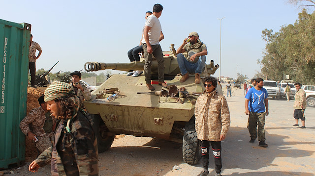 File photo: Members of the Libyan internationally recognised government forces gather around an armoured personnel carrier at Khallat Farjan area in Tripoli, Libya April 20, 2019