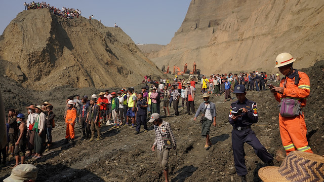 Local people look on in a jade mine where the mud dam collapsed in Hpakant, Kachin state, Myanmar April 23, 2019