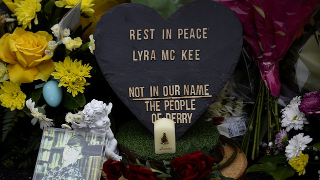 Flowers and a candle are left at the exact spot where 29-year-old journalist Lyra McKee was shot 
