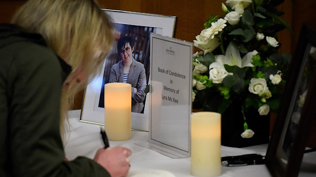 A woman signs a book of condolences in the Guildhall for the 29-year-old journalist Lyra McKee who was shot dead in Londonderry, Northern Ireland April 20, 2019.