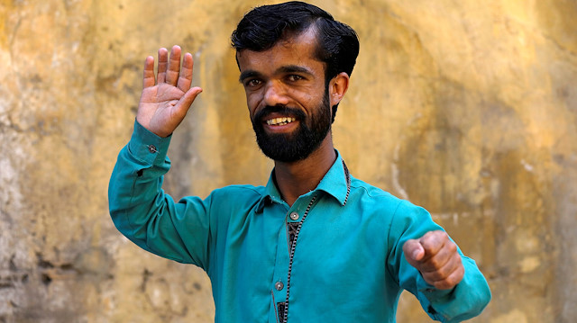 Rozi Khan, 26, a waiter and a lookalike of Hollywood's actor Peter Dinklage, who plays a character of Tyrion Lannister in the tv series "Game of Thrones", poses for a photograph in Rawalpindi, Pakistan April 28, 2019. Picture taken April 28, 2019. REUTERS/