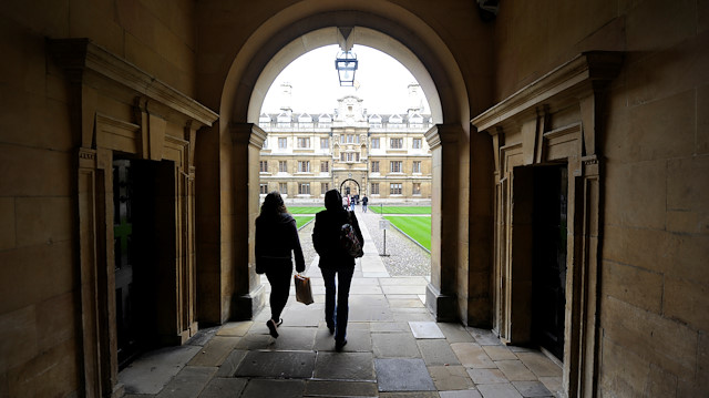 File photo: People walk into the quadrant of Clare College at Cambridge University in eastern England 